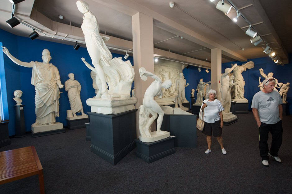 Visitors look at 19th-century plaster replicas of Greek and Roman figures