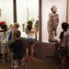 Kids standing in museum learning about African art