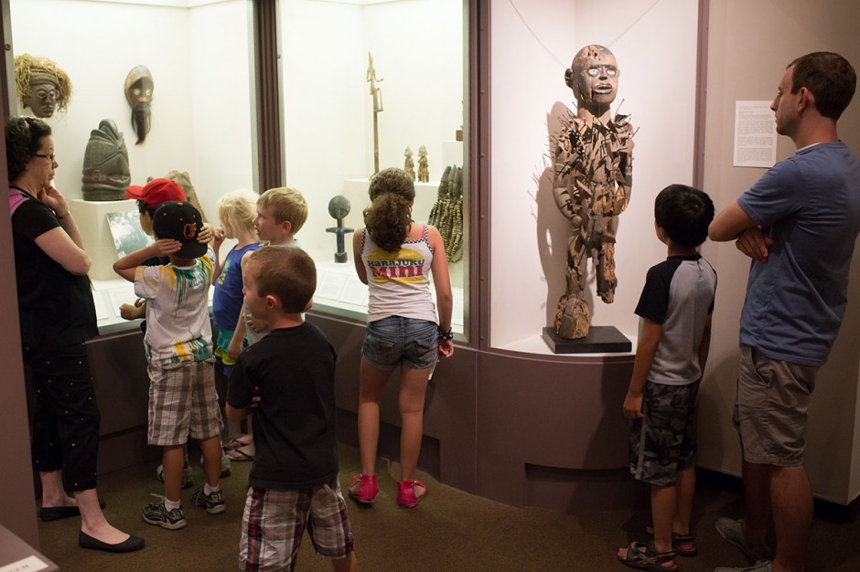 Kids standing in museum learning about African art