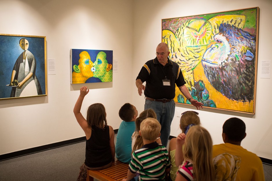 Kids sitting in museum learning about modern art