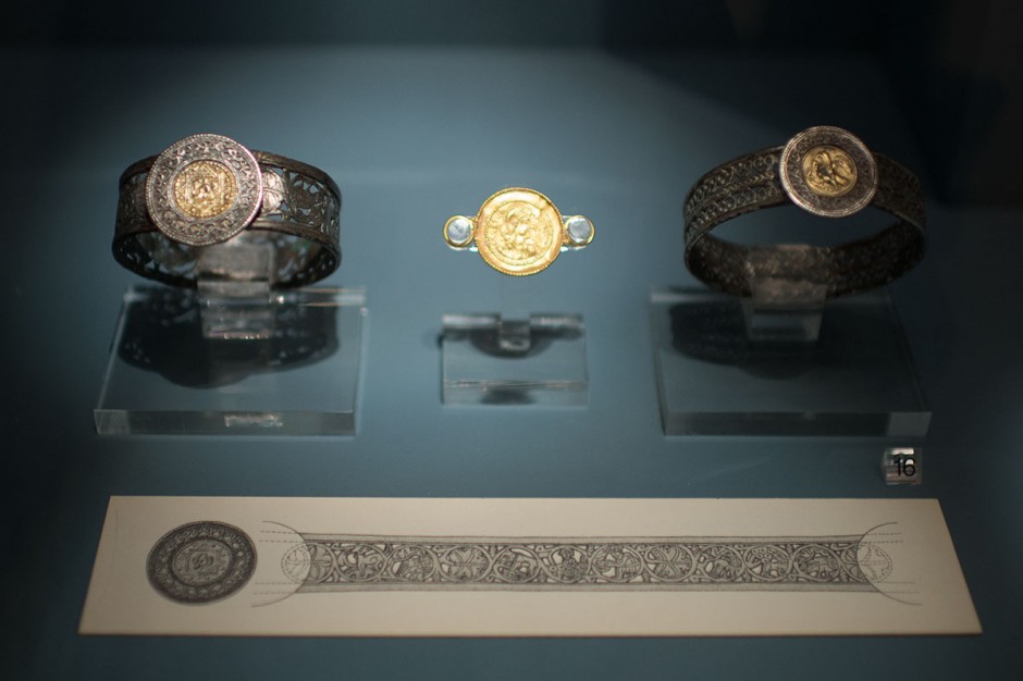 Silver and gold bracelets and a medallion