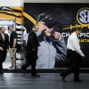 Gary Pinkel in front of a mural depicting Gary Pinkel
