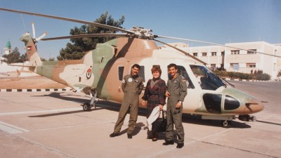 Winnie Fritz and fellow officers in front of a helicopter.