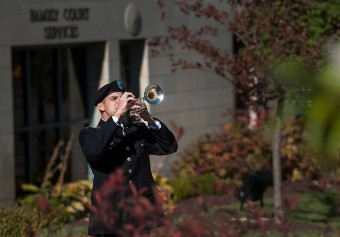 ROTC student playing taps.