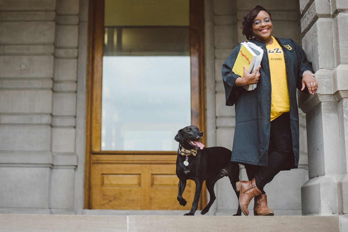 Jada Winchester and her dog in front of Jesse Hall.