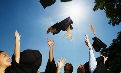 Mizzou graduates throw their caps in the air
