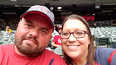 This is a picture of Jennifer Foster and her husband at a Cardinals game