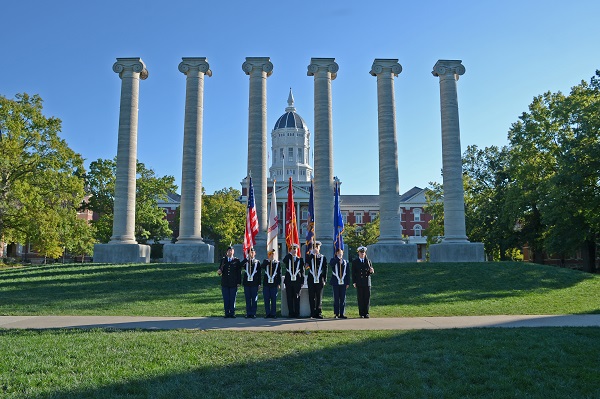 This is a picture of ROTC members in front of Jesse Hall and the Columns