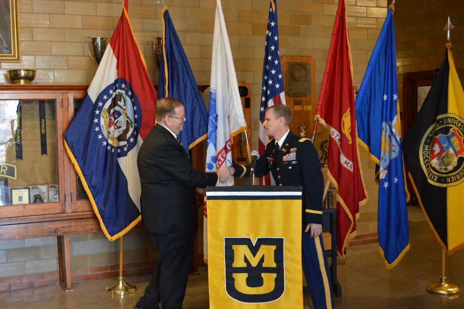 This is a picture of Chancellor Cartwright and Lt. Col. Kerr shake hands after announcing the new ROTC scholarships announcing room and board for incoming ROTC students.