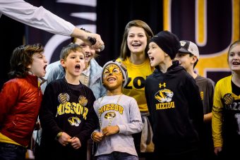 Five-year-old David Overstreet, III, with faceprint, son of Chelsea Brooks ('08) and David Overstreet, II, leads an M-I-Z cheer with other children during the Mizzou Alumni Association Tiger Tailgate before the Texas Bowl at NRG Stadium in Houston, Texas, on Wednesday, Dec. 27, 2017.