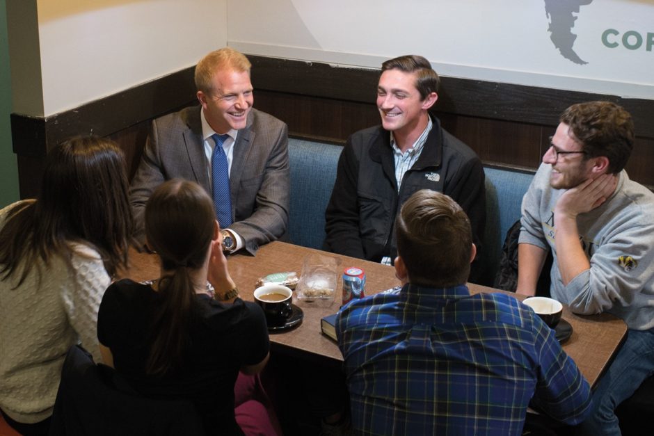 This is a picture of Thom Lambert having coffee with students