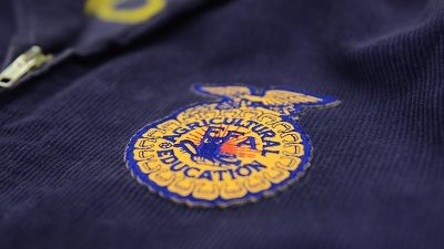 This is a picture of a FFA badge on a blue jacket.