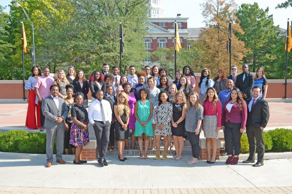 This is a group photo of MCAC college advisers on Traditions Plaza in front of Jesse Hall