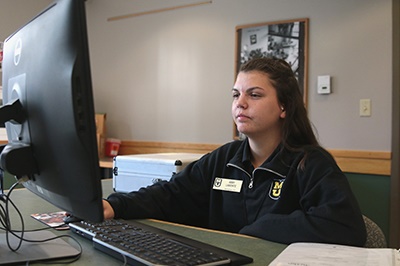 Abby Labonte working as a Desk Attendant for Residential Life.