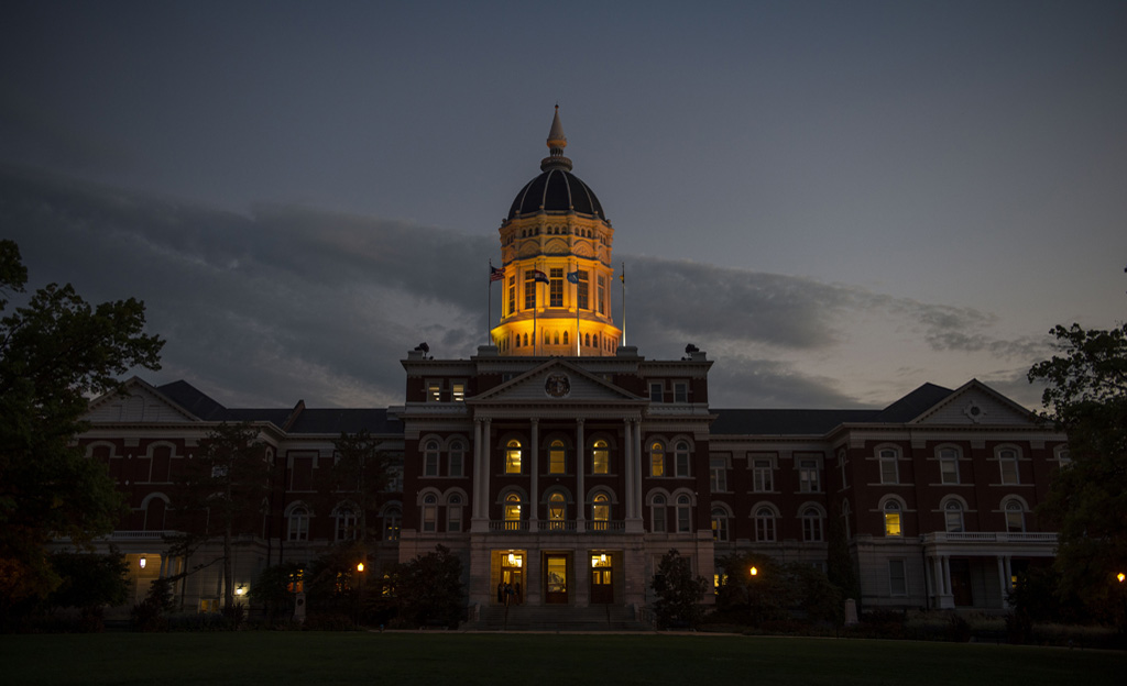 Jesse Hall dome glowing gold at dusk