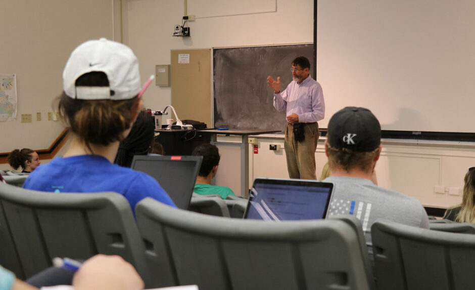 Dr. Smith speaks to students in a genetics class