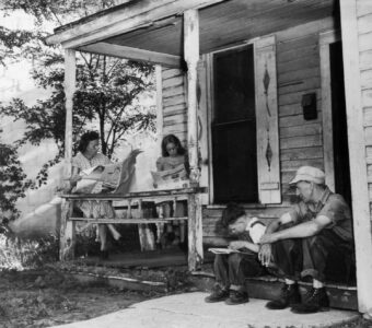 family sitting on porch