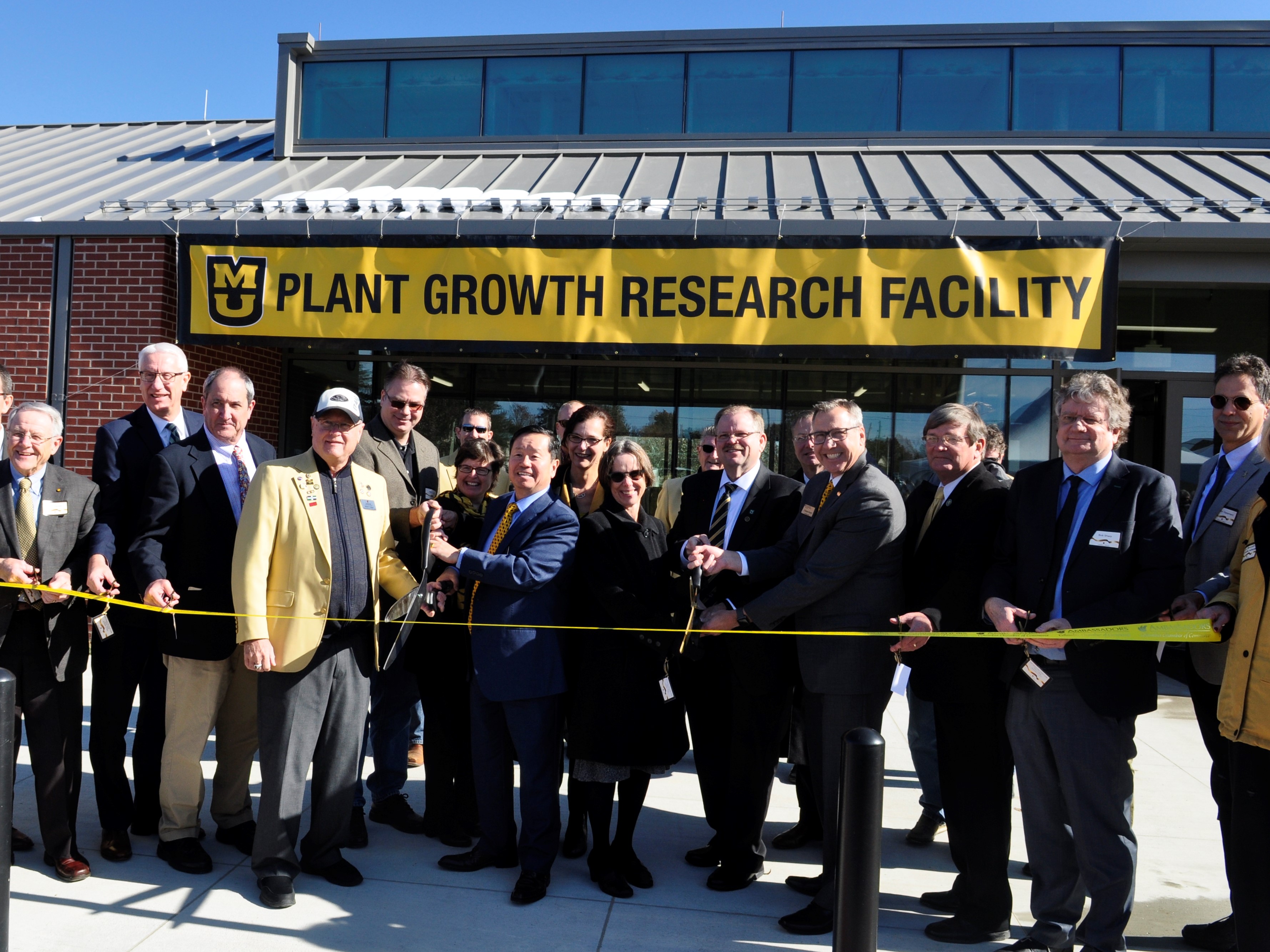 This is a picture of the ribbon-cutting at the East Campus Plant Growth Facility