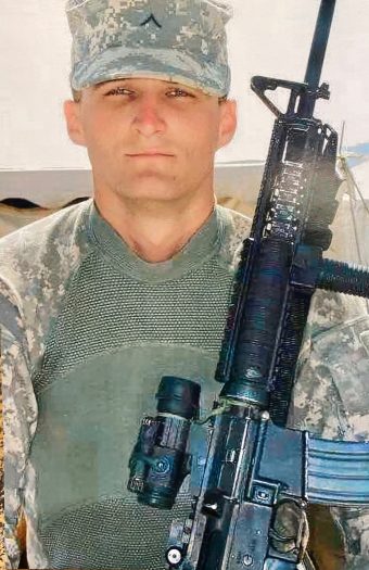 Soldier holding a military rifle