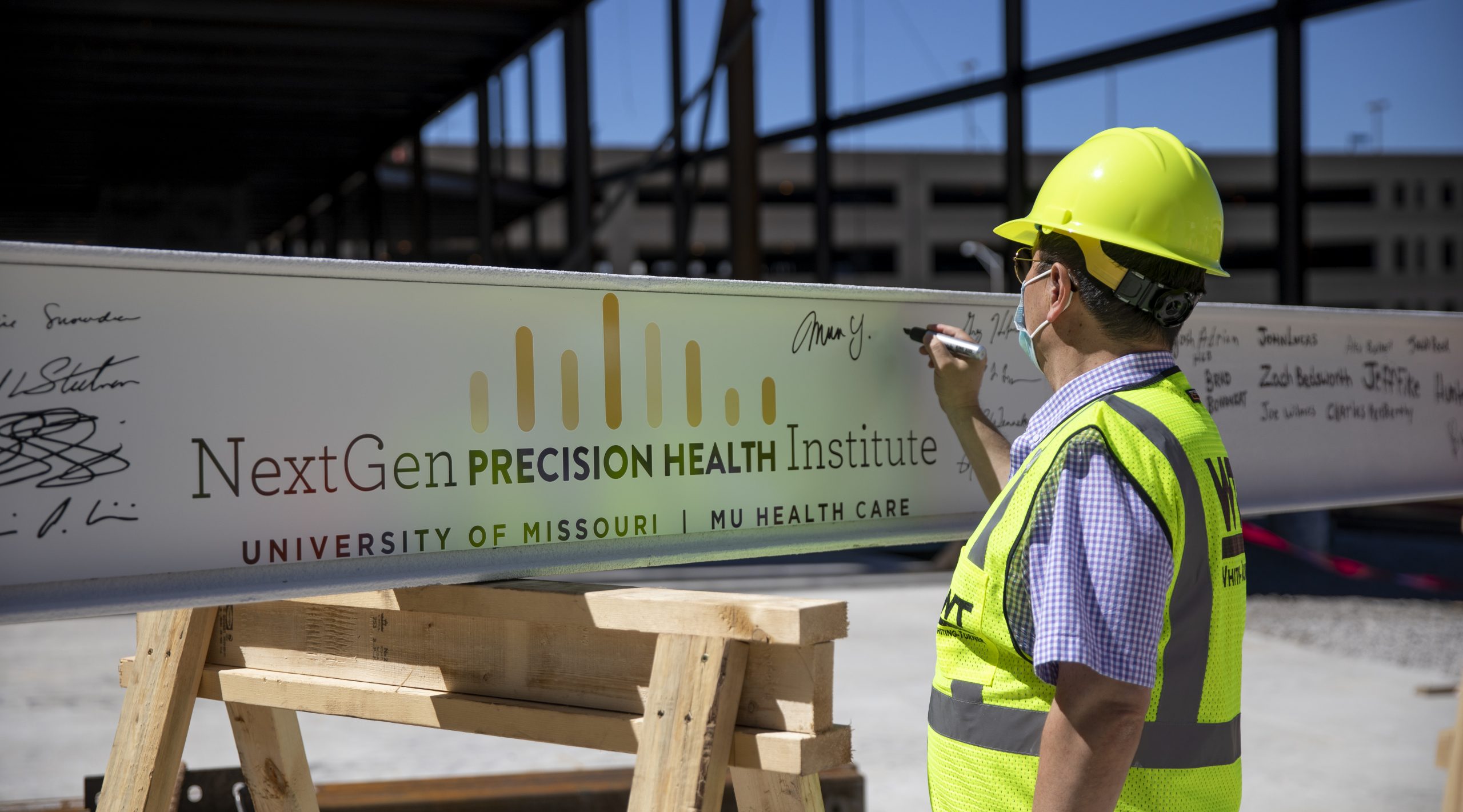 NextGen Precision Health Institute topping off photos