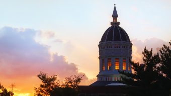 summer clouds hide sunset behind Jesse dome taken from lowry mall
