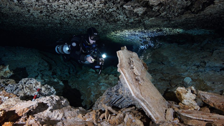 This is a picture of a cave diver in Mexico's ancient underwater ochre mine.
