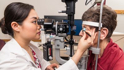 photo of ophthalmologist treating a patient's eye