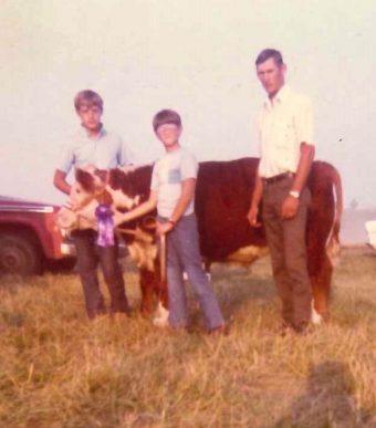 Mike Kateman, center, with his calf, Boots. 
