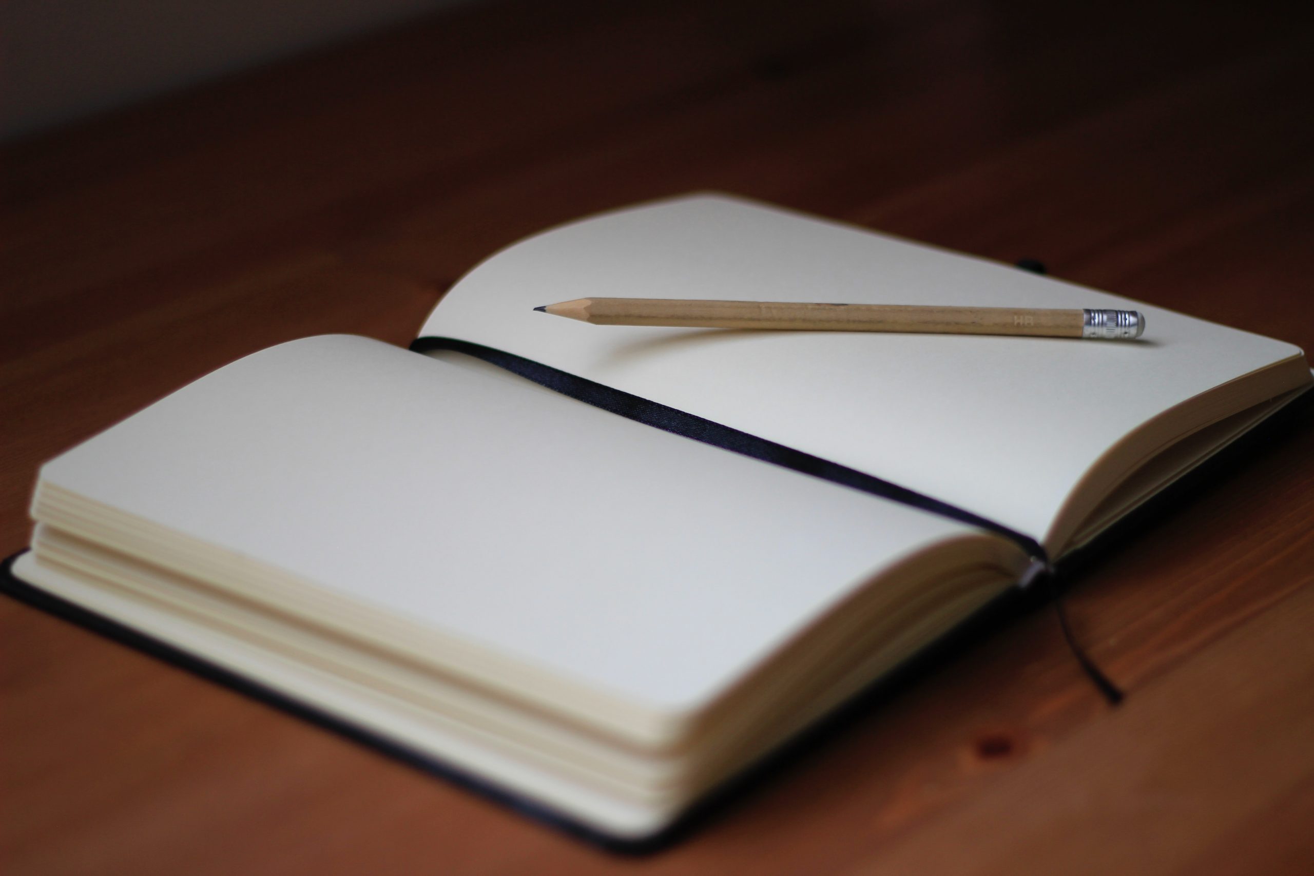 open notebook with a pencil