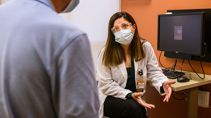 Infectious Diseases physician, Dima Dandachi, MD, sees a patient at the University Physicians Medicine Specialty Clinic.