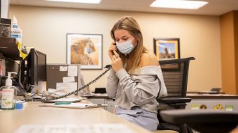 Coleen Smith attends the front desk in the Wellness Resource Center