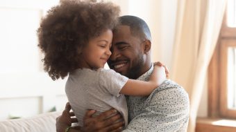 This is an image of a happy father and daughter.
