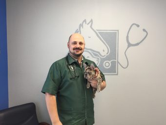 Dr. Sikes holding a dog