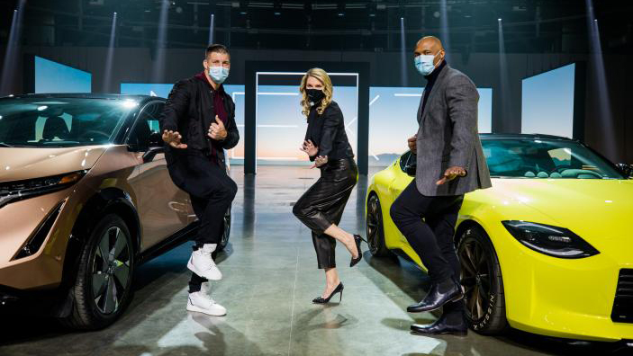 Allyson Witherspoon at a Nissan brand event alongside two former Heisman Trophy winners: Tim Tebow, left, and Eddie George.