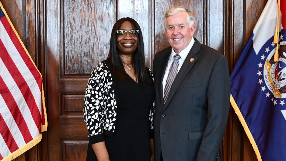 Ransome and Gov. Parson smile for a photo