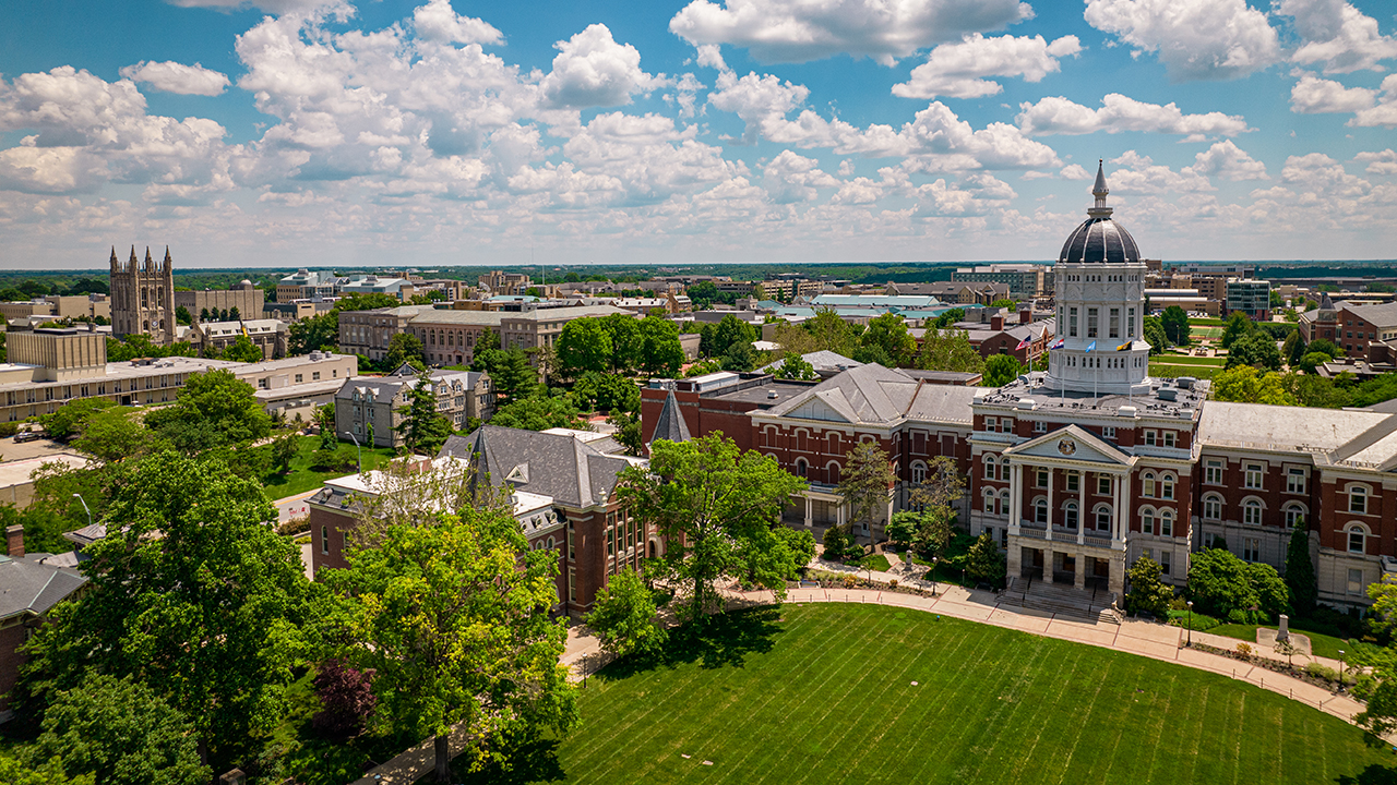 drone shot of jesse hall and campus in summer