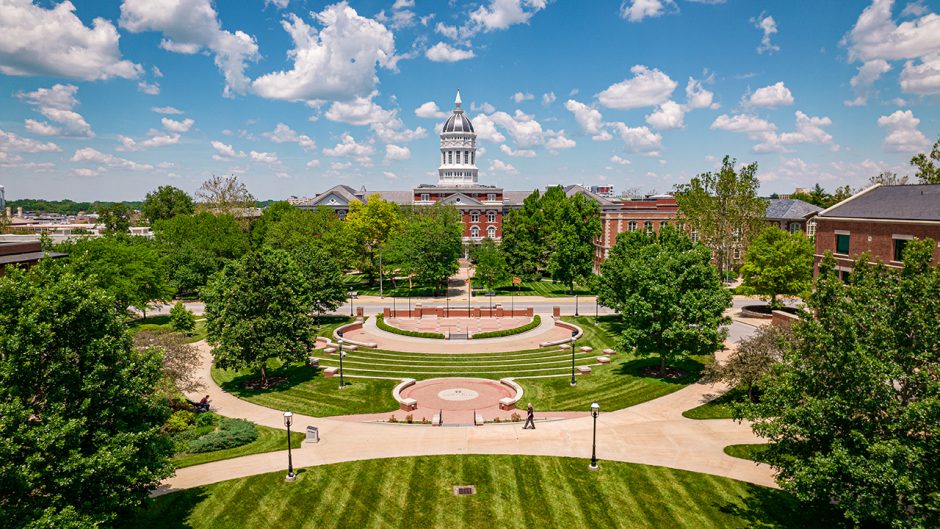 drone shot of jesse hall and traditions plaza during summer