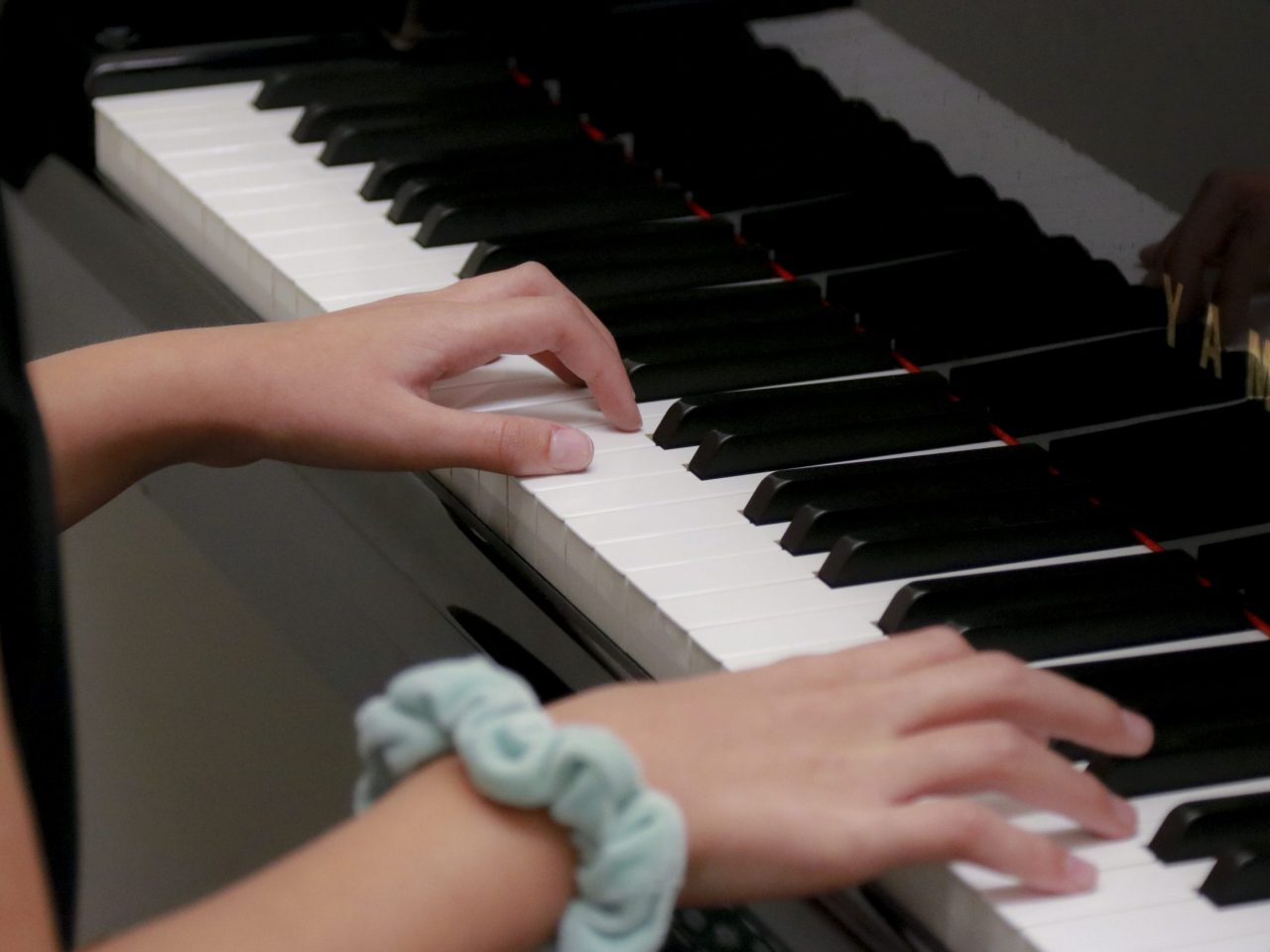 student plays piano