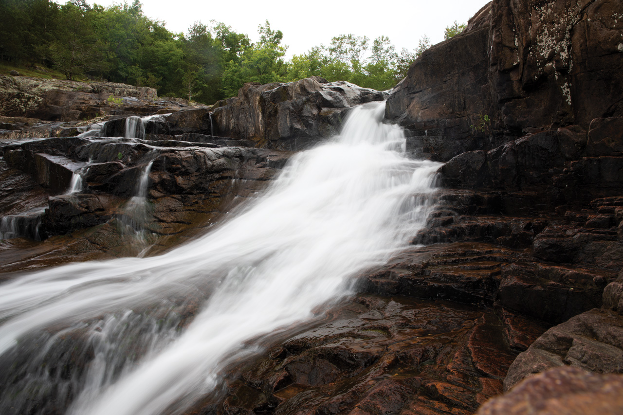 spring water rushing down rocks