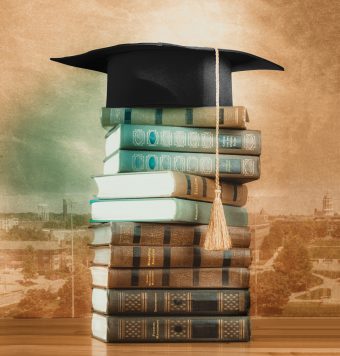 mortar board on a stack of books