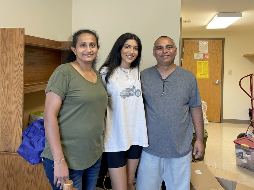 Gehana Patel (center) with her parents, Mital (left) and Neal (right).