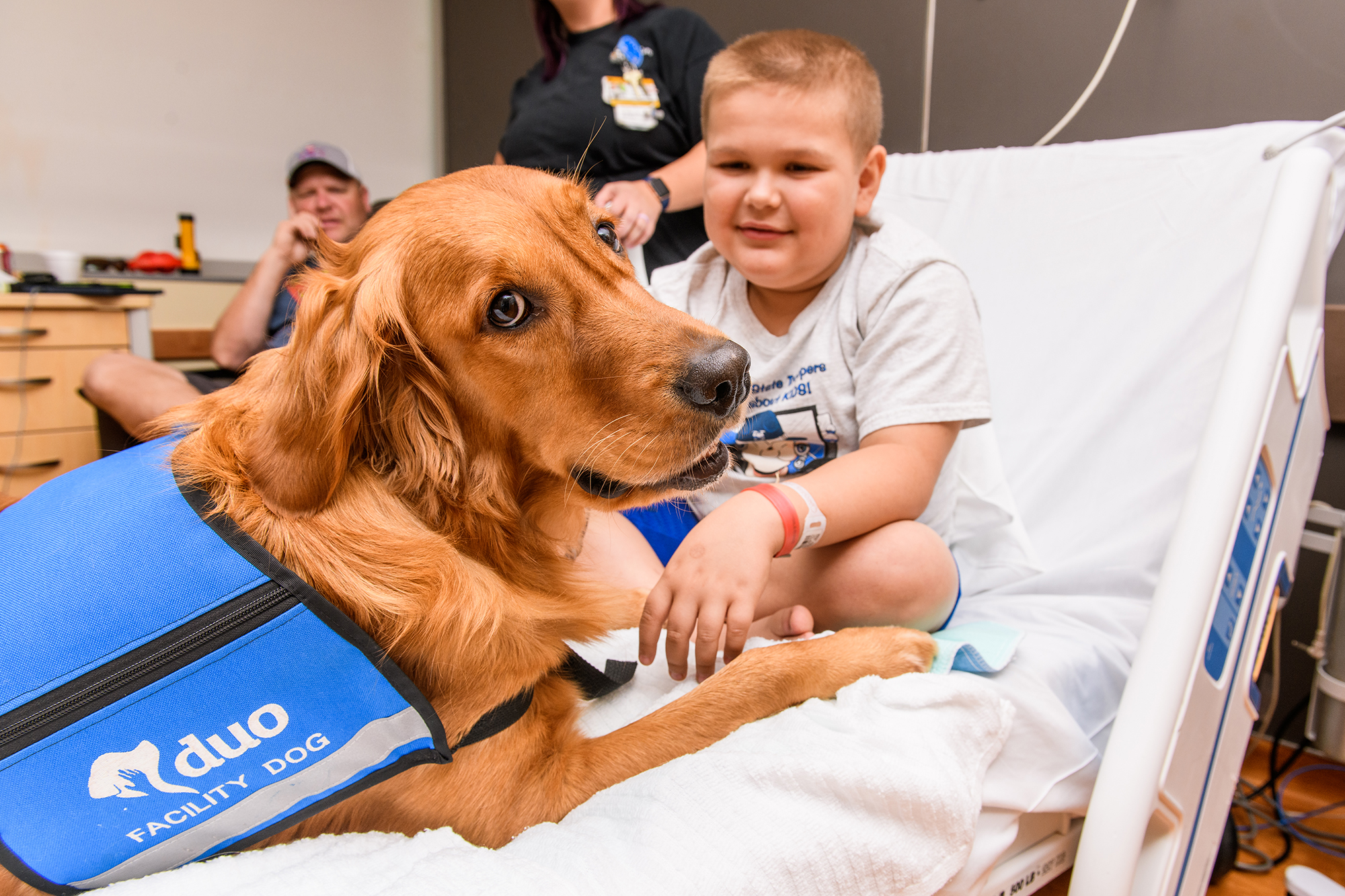 Kale West, 9, of Boonville meets with Link, the University of Missouri Children's Hospital facility dog Link.