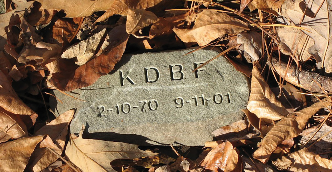 memorial stone with leaves