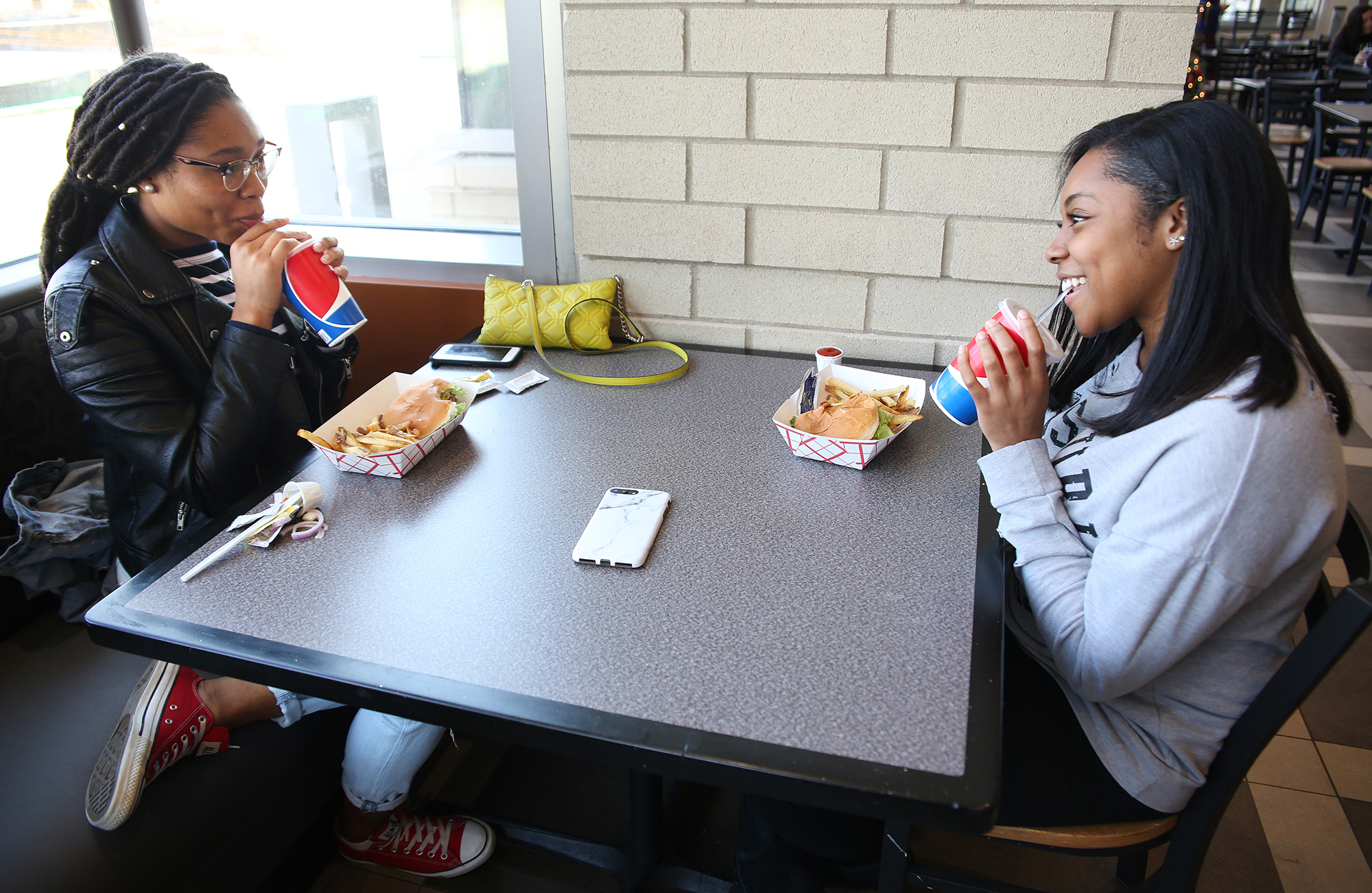 two students eat lunch at The MARK