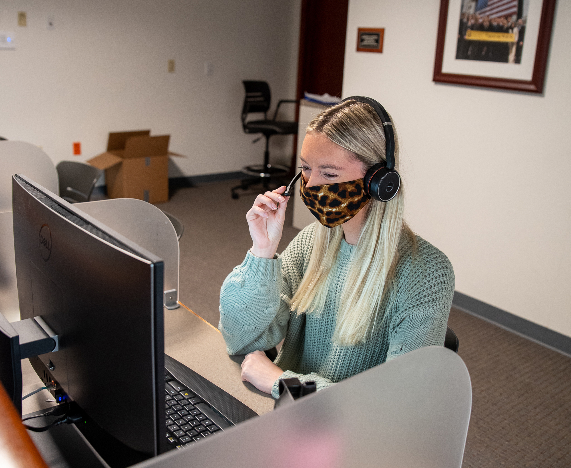 student on the phone in the inside sales lab