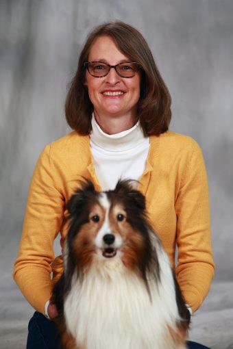 This is a photo of Gretchen Carlisle and a dog.