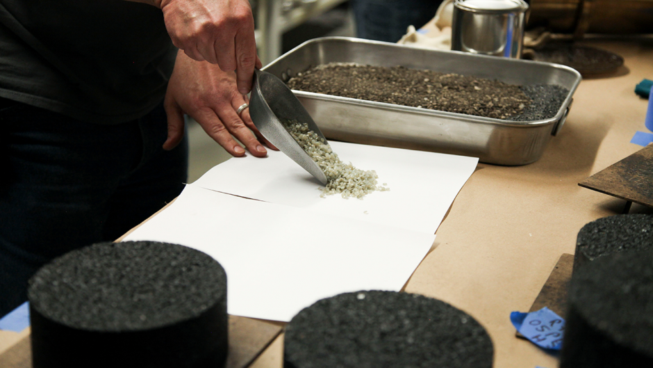 Lab staff in the Mizzou Asphalt Pavement and Innovation Lab, or MAPIL, show the plastic waste particles that are being added to the pavement mixture. The lab is located inside the MU College of Engineering.