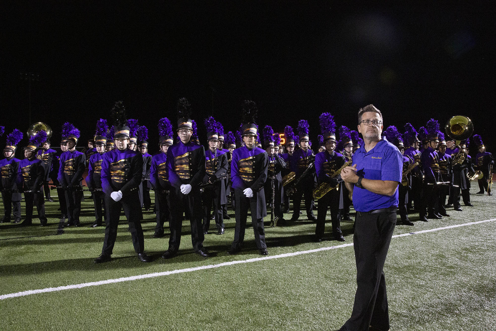 denis swope looks on with the hickman marching band behind him
