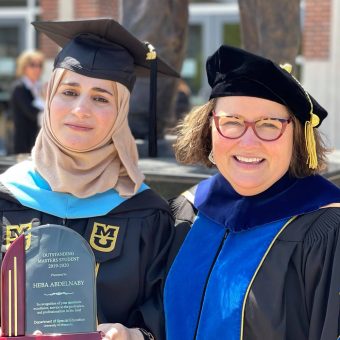 photo of a student and her dean at graduation