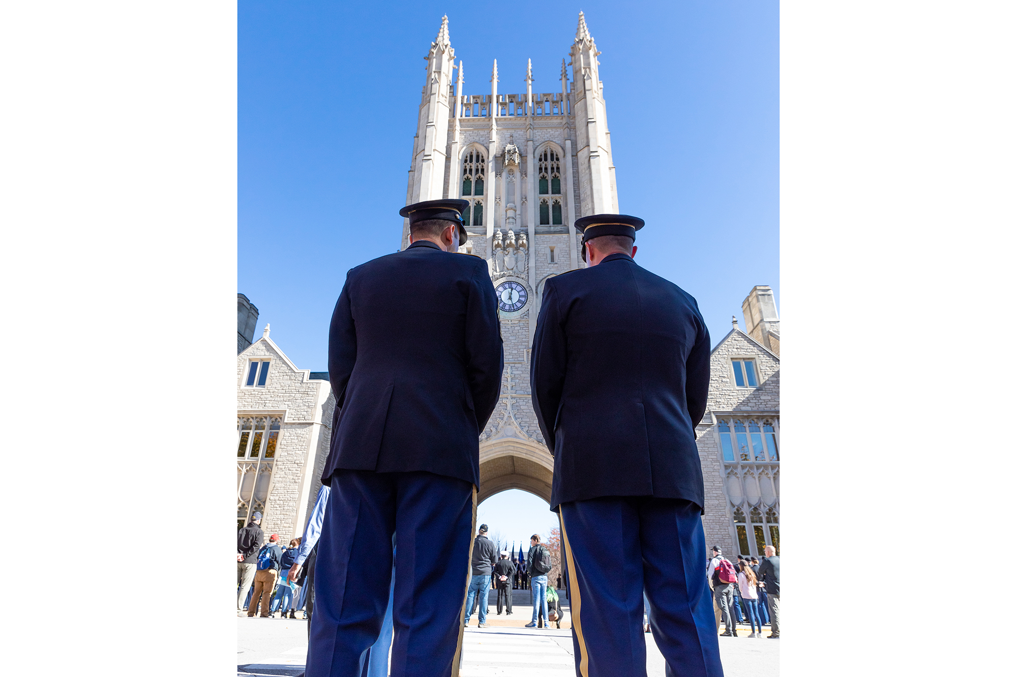 photo of two uniformed men in front of memorial union